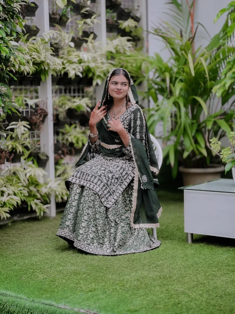 an elegant bride sitting in a garden by best wedding photography in calicut